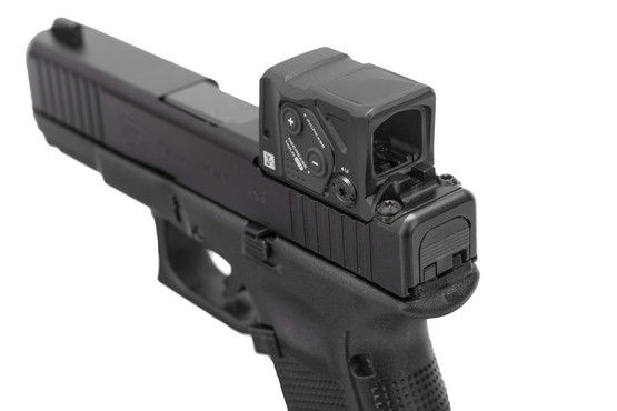 Semi automatic 9mm pistol with Aimpoint COA.